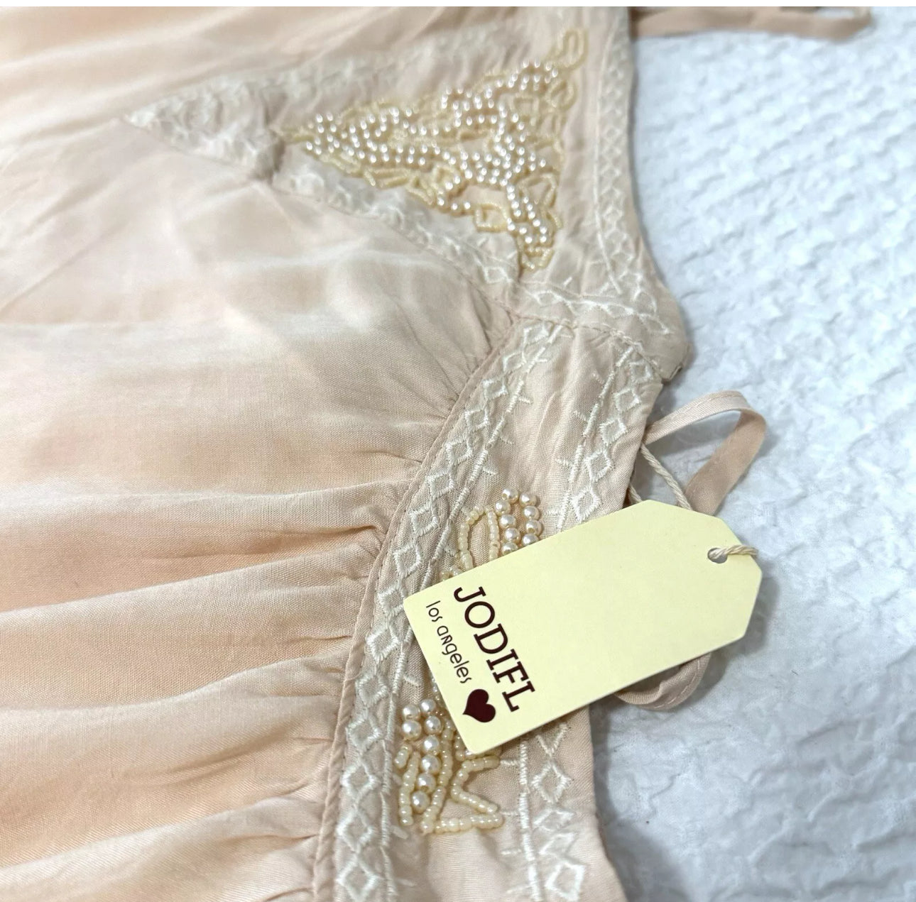 Jodifl Creamy Blush Strappy Boho Tassel Beaded Mini Dress