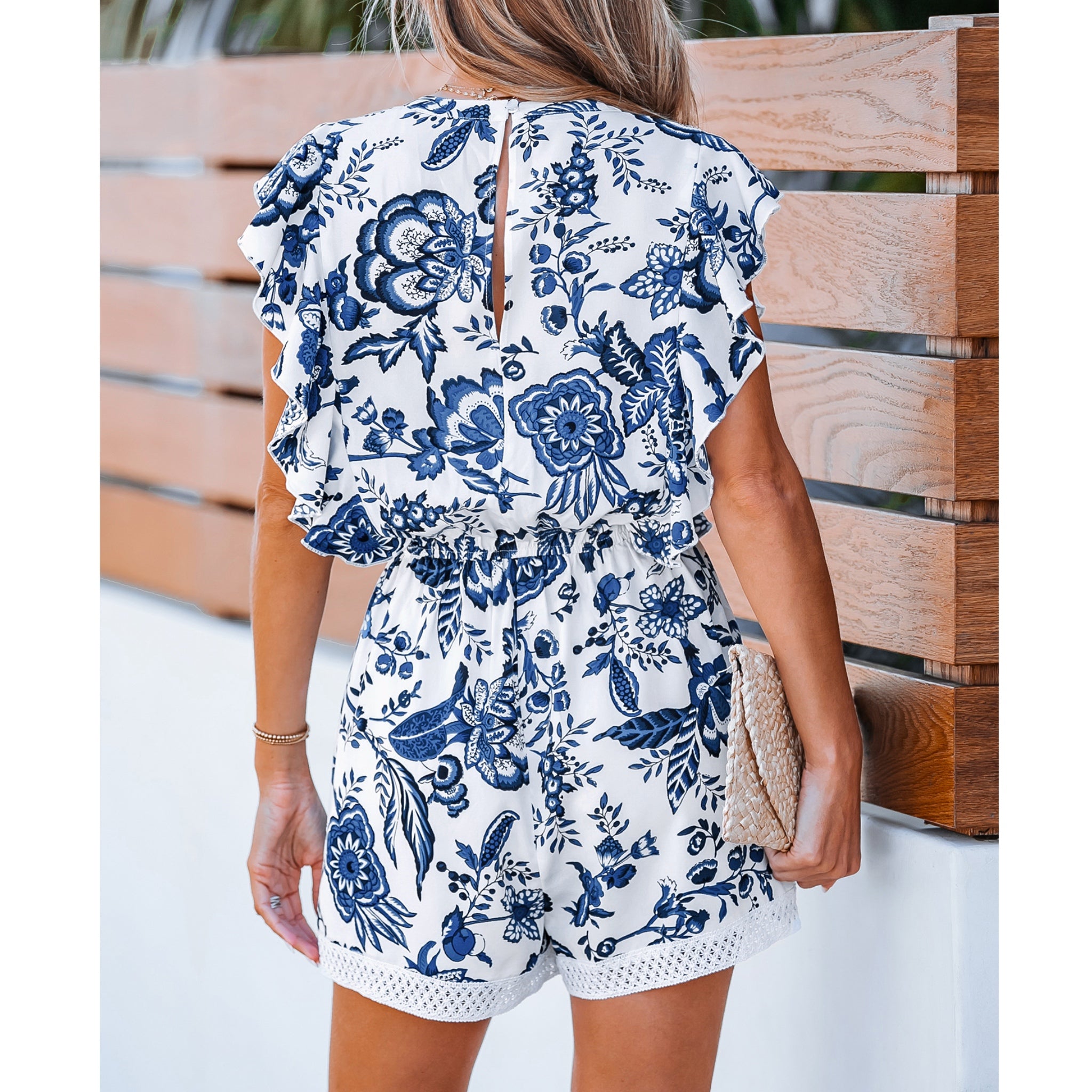 Floral Print Ruffled Tassel Tie Beachy Romper in Coastal Blue and White